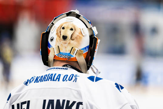 Goaltender Christian Heljanko of Finland with a picture of