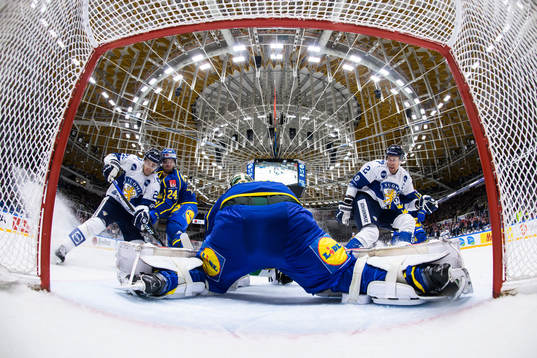Ahti Oksanen and Marko Anttila of Finland try to score