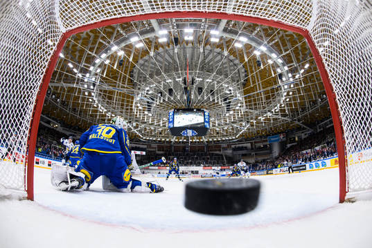 Antti Suomela of Finland scores 2-2 behind goaltender