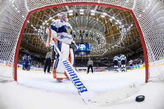 Goaltender Christian Heljanko of Finland looks dejected
