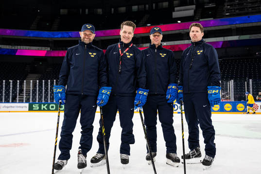 Goaltender coach Stefan Ladhe, head coach Sam Hallam,