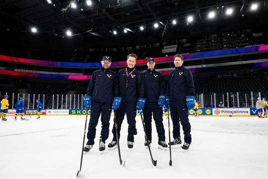 Goaltender coach Stefan Ladhe, head coach Sam Hallam,