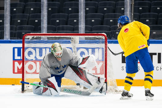 Goaltender Jesper Wallstedt and Marcus Sörensen of Sweden