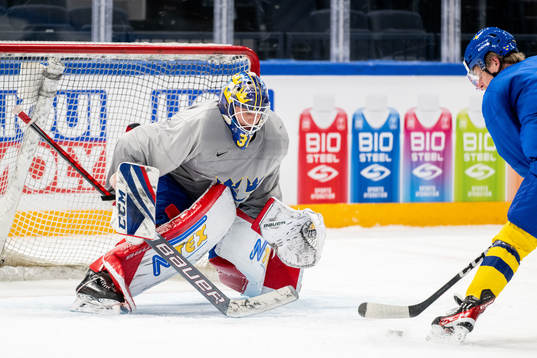 Goaltender Lars Johansson and Jonatan Berggren of Sweden at