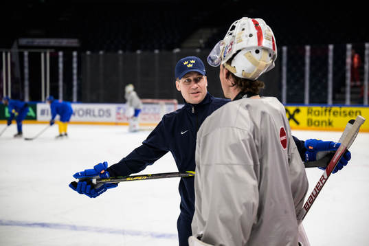 Head coach Sam Hallam and goaltender Jacob Johansson of