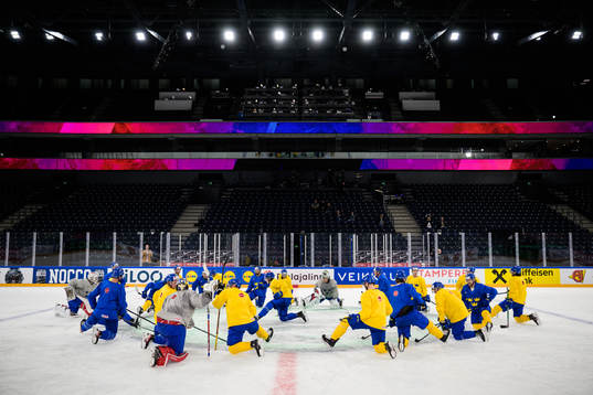 Players of Sweden stretching at a practice session
