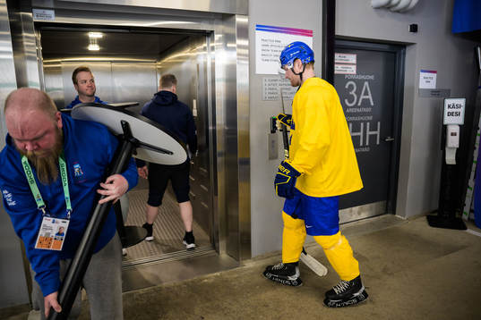 Carl Grundström of Sweden walking into an elevator to get