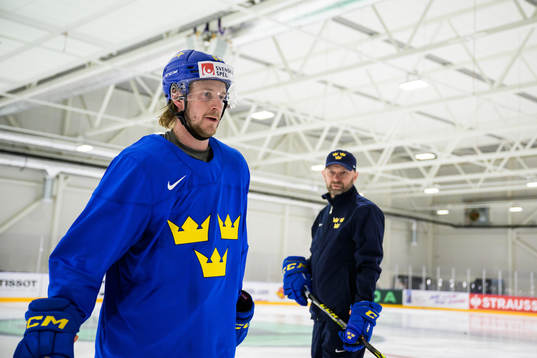 Jonathan Pudas and goaltender coach Stefan Ladhe of Sweden
