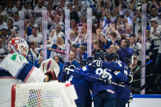 Teemu Hartikainen of Finland celebrates with teammates