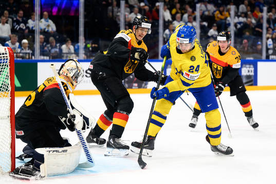 Goaltender Mathias Niederberger and Maksymilian Szuber of