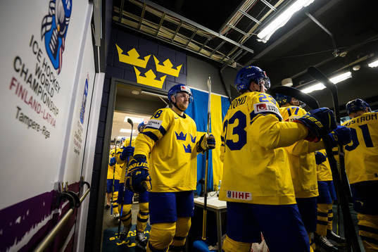 Alexander Nylander and Lucas Raymond of Sweden leave the