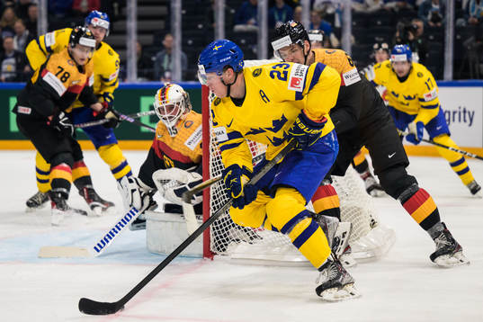 Lucas Raymond of Sweden challenges goaltender Mathias