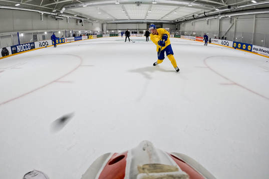 Joel Persson shoots against goaltender Jacob Johansson of