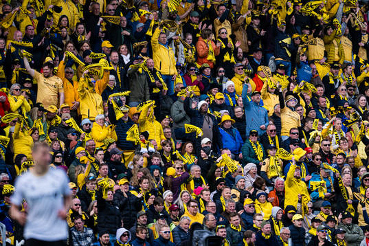 Spectators in the stands at Aspmyra Stadion