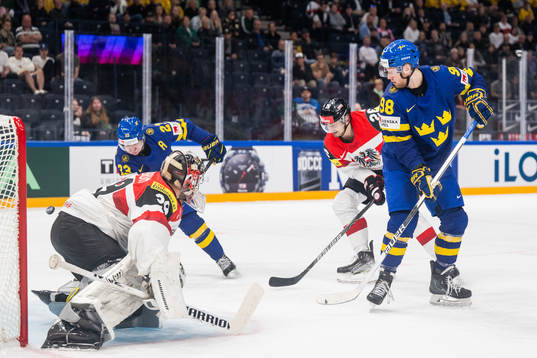 goaltender Bernhard Starkbaum and Oliver Achermann of