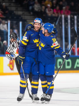 Patrik Nemeth and Rasmus Sandin of Sweden celebrate