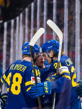 Alexander Nylanderand Lucas Raymond celebrate with Leo