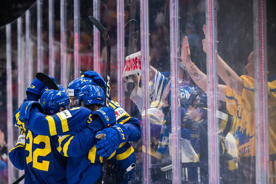Dennis Everberg of Sweden celebrates with team mates