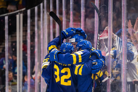 Dennis Everberg of Sweden celebrates with team mates