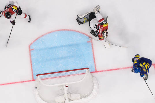 Leo Carlsson of Sweden scores 4-0 behind goaltender