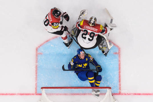 Lucas Raymond of Sweden crashes into the net behind Nico