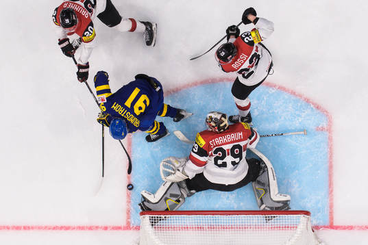Carl Grundström of Sweden challenges Nico Brunner,