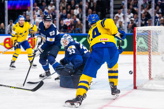 Oscar Lindberg of Sweden with a shot in the post next to