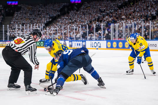 Jacob de la Rose of Sweden face off against Juho Lammikko