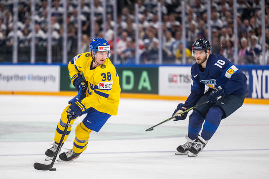 Rasmus Sandin of Sweden and Joel Armia of Finland
