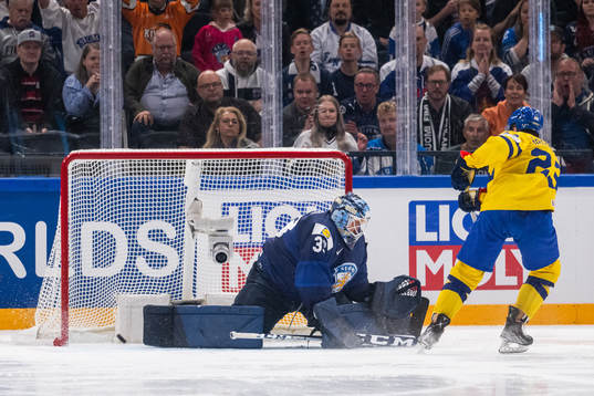 Lucas Raymond of Sweden scores a penalty shot behind