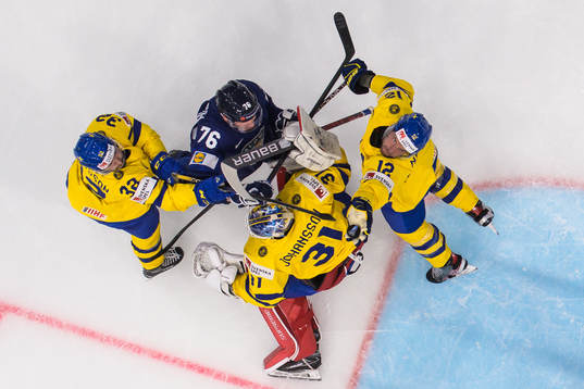 Jere Sallinen of Finland challenges Lukas Bengtsson,
