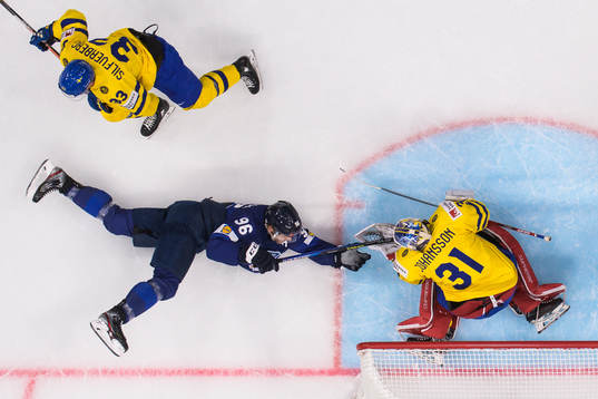 Mikko Rantanen of Finland challenges Jakob Silfverberg and