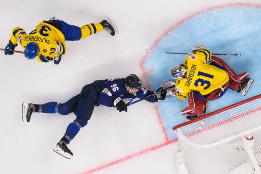Mikko Rantanen of Finland challenges Jakob Silfverberg and