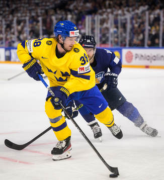 Rasmus Sandin of Sweden and Joel Armia of Finland