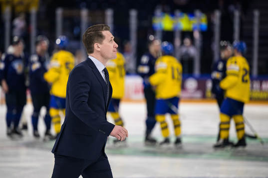 Head coach Sam Hallam of Sweden walks off the ice