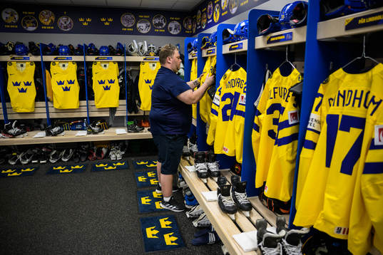 Equipment manager Frederik Andersen of Sweden hangs jerseys