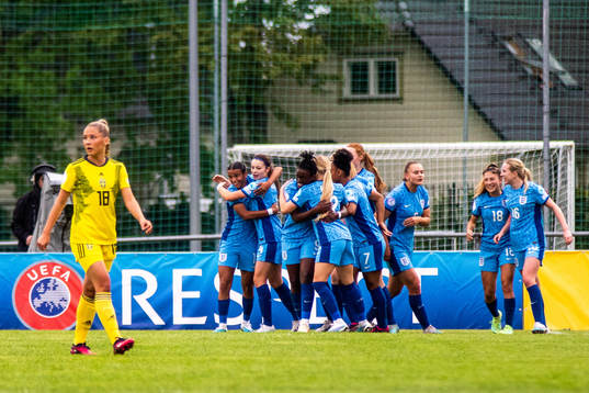 Players of England celebrate as Novalie Jensen of Sweden