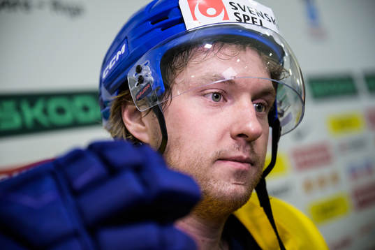 Rasmus Sandin of Sweden being interviewed at a practice
