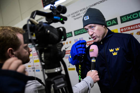 Head coach Sam Hallam of Sweden being interviewed at a