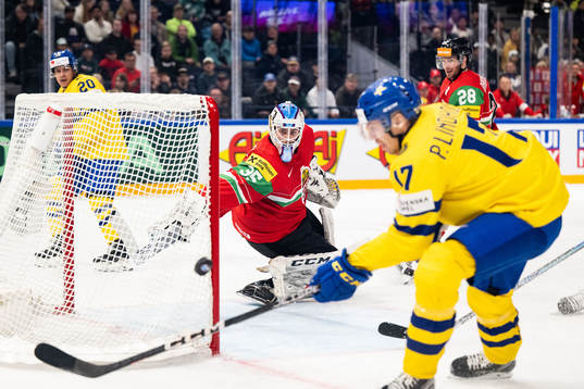 André Petersson of Sweden and goaltender Dominik Horvath