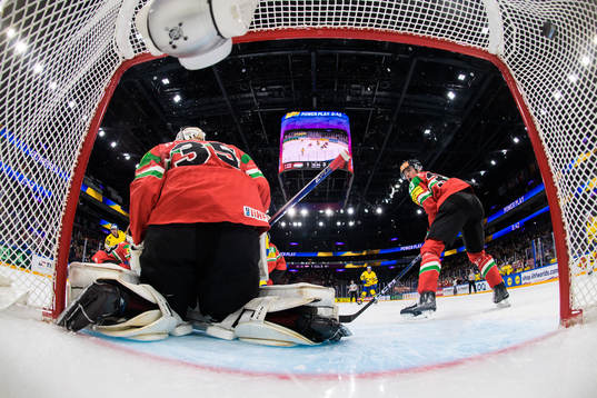 André Petersson of Sweden scores 1-4 behind goaltender