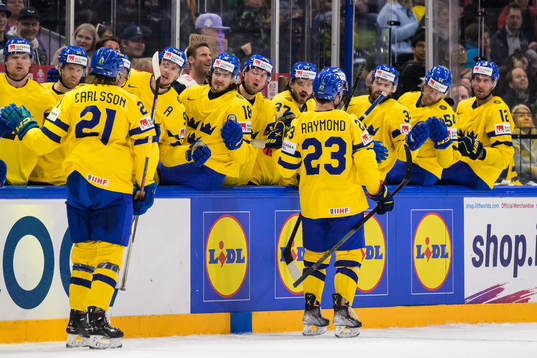 Lucas Raymond of Sweden celebrates with teammates