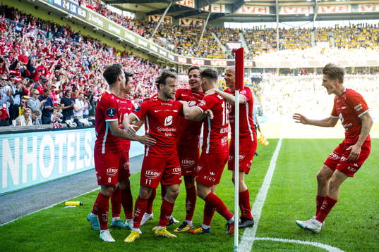 Bård Finne of Brann celebrates scoring 2-0 with teammates
