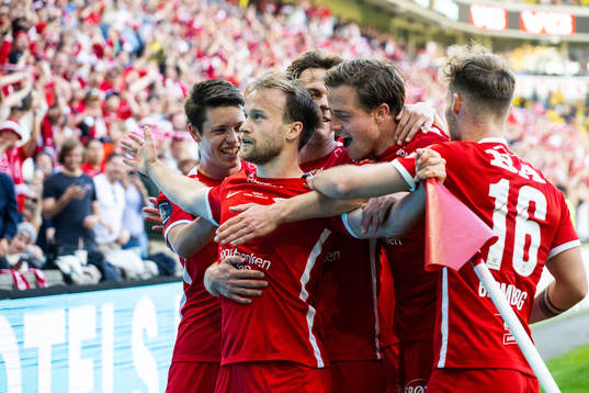 Bård Finne of Brann celebrates scoring 2-0 with teammates