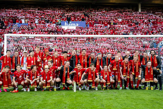 Players and staff of Brann celebrate