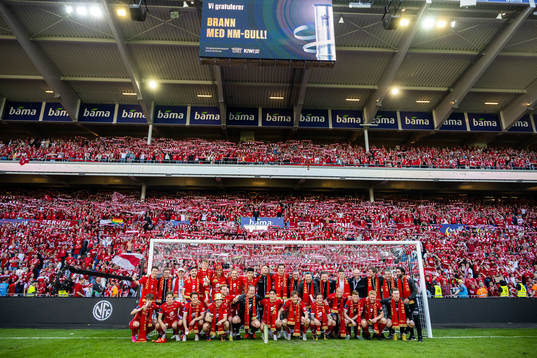 Players and staff of Brann celebrate