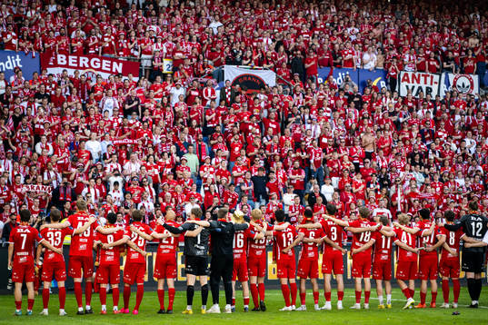 Players and staff of Brann celebrate