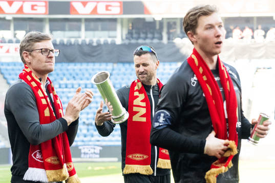 Head coach Eirik Horneland of Brann celebrates with trophy