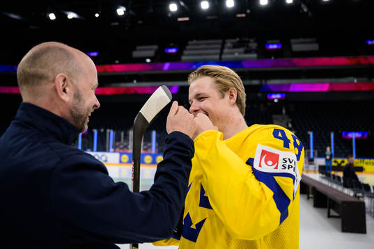 Goaltender coach Stefan Ladhe and Jonatan Berggren of