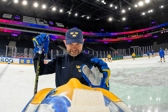 Goaltender coach Stefan Ladhe talks to goaltender Jesper